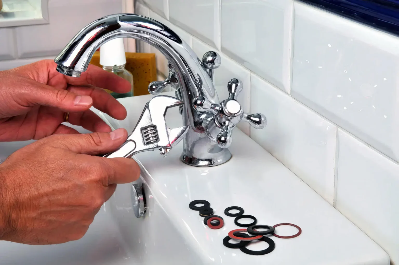 Plumber maintaining a bathroom faucet in Port Hueneme